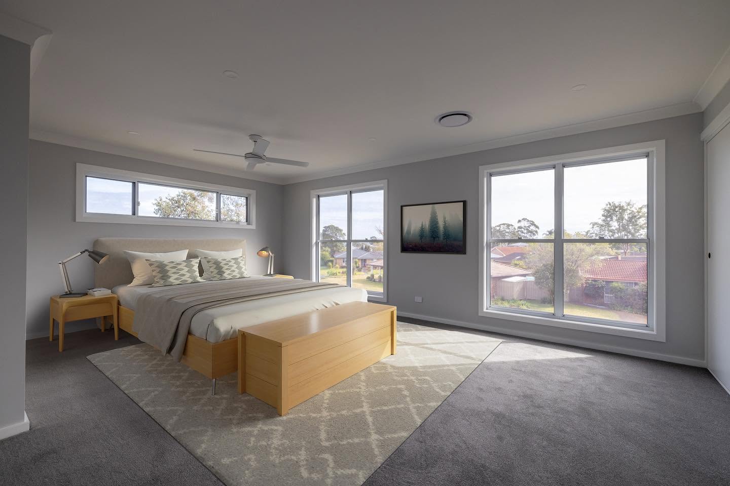 Light filled main bedroom with highlight windows and district outlook